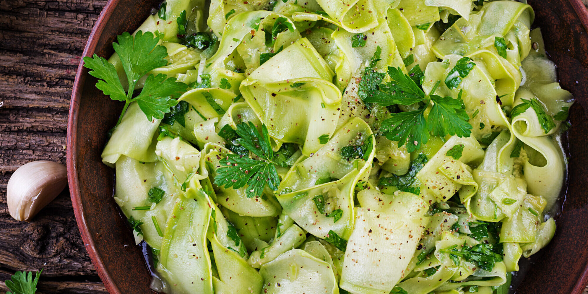 Salad of marinated zucchini in spices. Vegan food. Healthy meal. Top view alad of marinated courgette in spices.