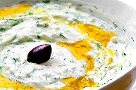 homemade tzatziki dip with an olive in the centre