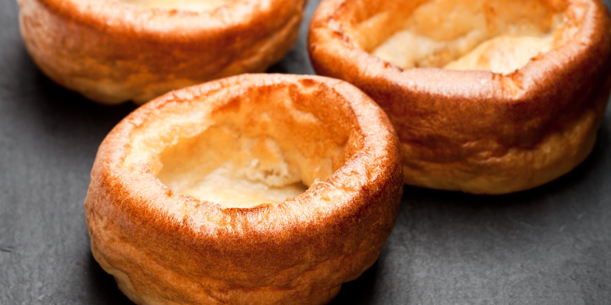 Yorkshire  puddings isolated on black stone background