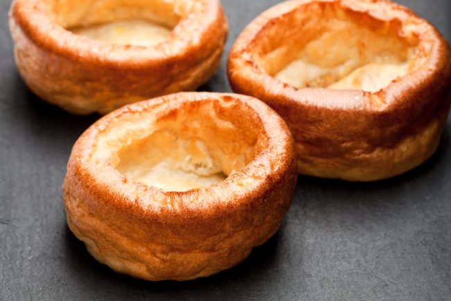 Yorkshire  puddings isolated on black stone background
