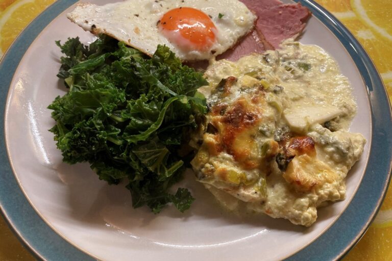 celeriac gratin with ham, fried egg and kale