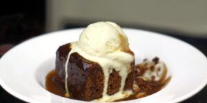 Sticky toffee pudding with ice cream drizzled on top. From a pub in Cambridgeshire