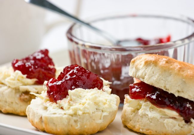 Home-baked scones with strawberry jam and clotted cream.