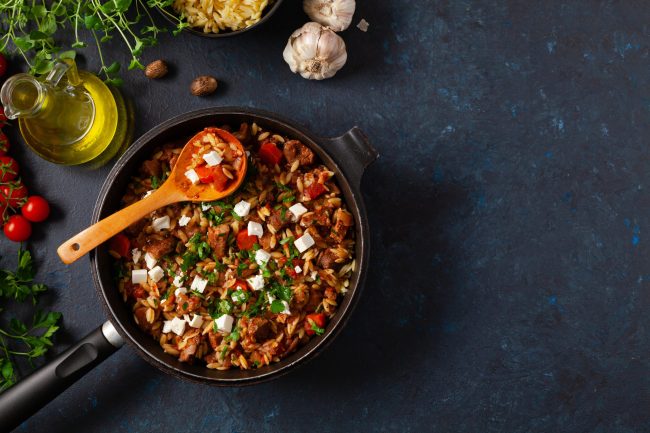 Traditional Greek cuisine. Lamb stew with feta cheese and vegeta