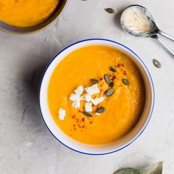 two bowls of soup set on a table