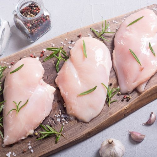 Raw chicken breast ( fillet ) with ingredient . Meat background