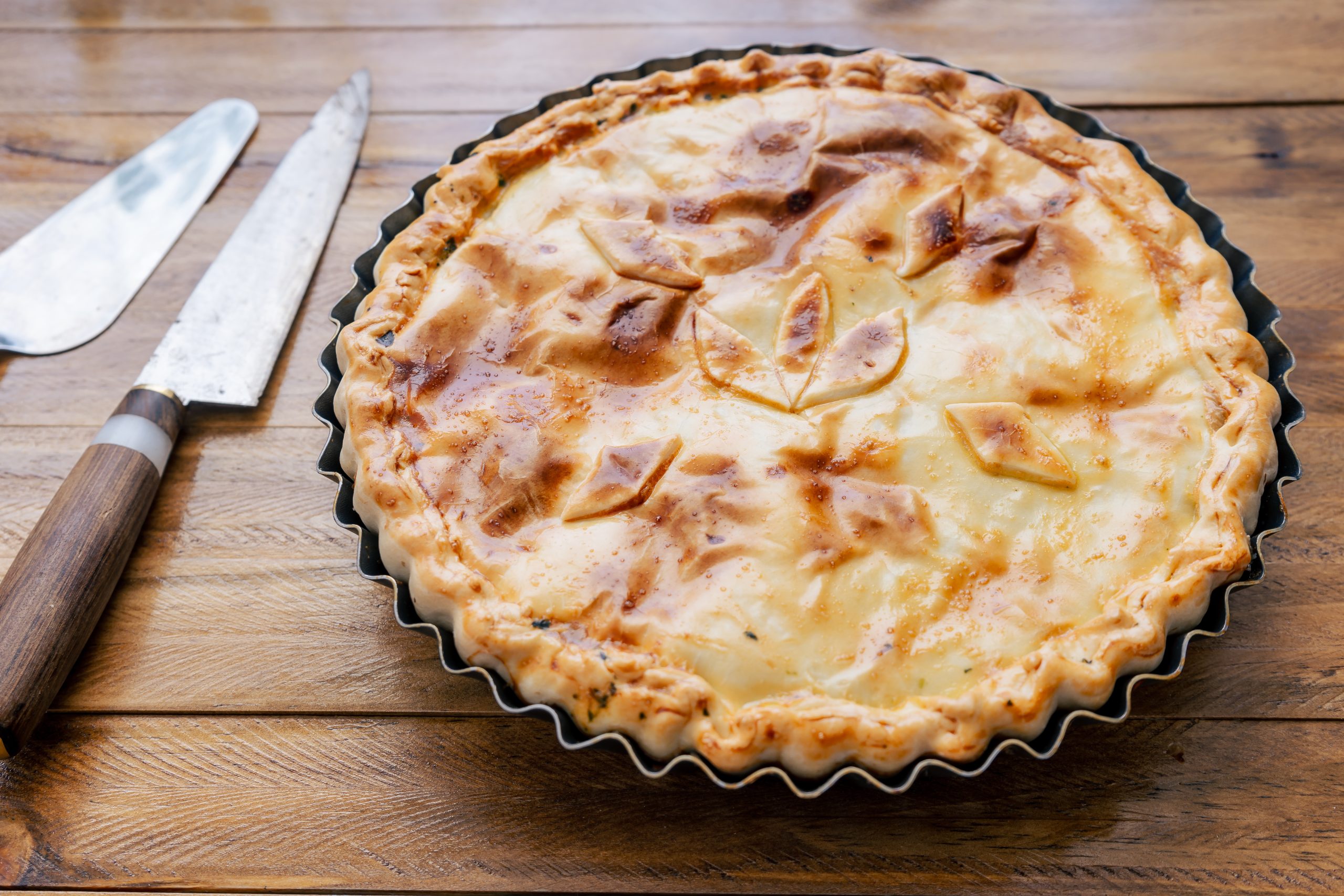 Spinach Pie with Egg or Spinach Quiche Lorraine. Salty tart with vegetables, spinach and egg. Home food, healthy and natural concept.