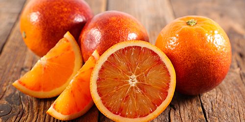 bloody orange on wood background