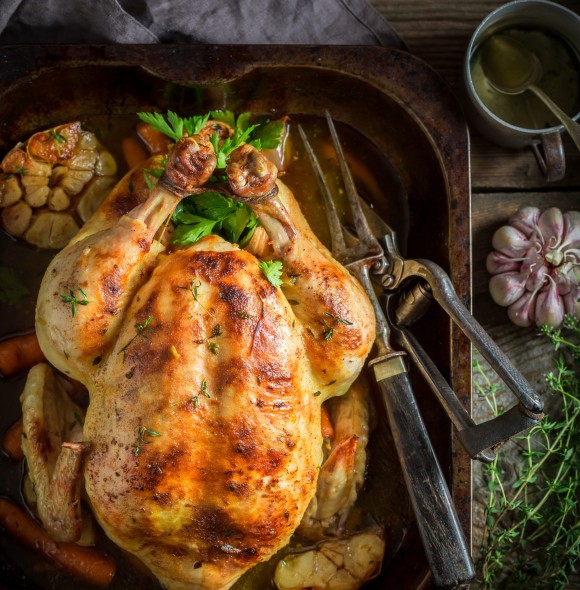 Tasty roasted chicken with spices and vegetables