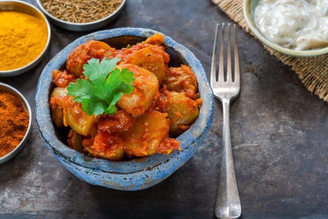 Bombay aloo – Indian spiced potatoes with tomato sauce and minte