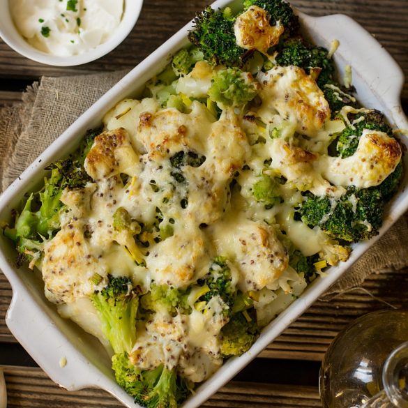 Healthy baked gratin of cauliflower, broccoli and romanesco with cream and mustard sauce
