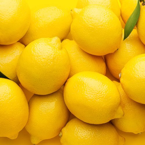 Fresh ripe lemons as background
