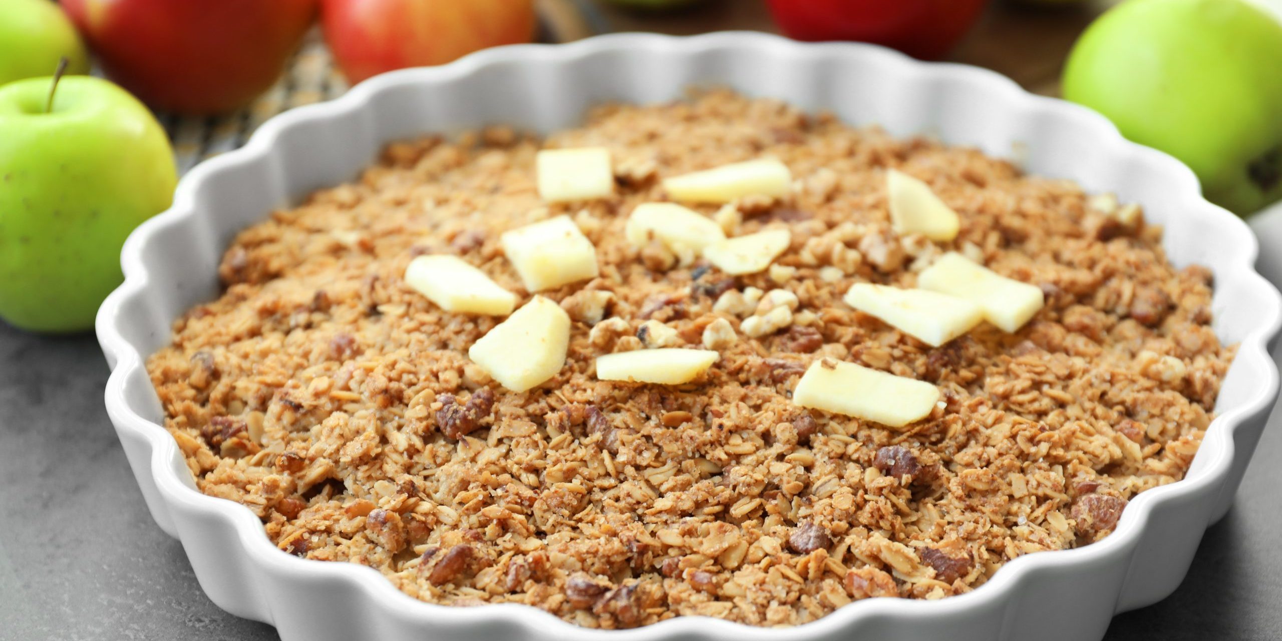 Baking dish with apple crisp on table