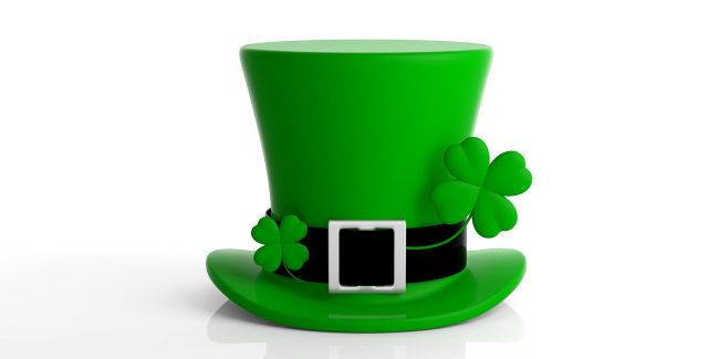 St Patricks Day leprechaun hat with four leaf clover isolated on