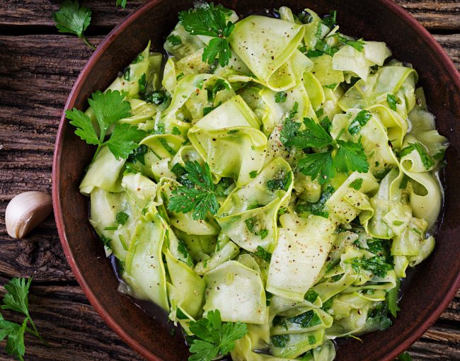 Salad of marinated zucchini in spices. Vegan food. Healthy meal. Top view