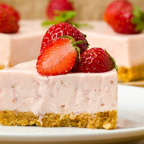 Homemade strawberry cheesecake  on white plate