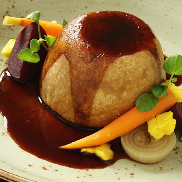 plated steak steamed pudding with vegetables