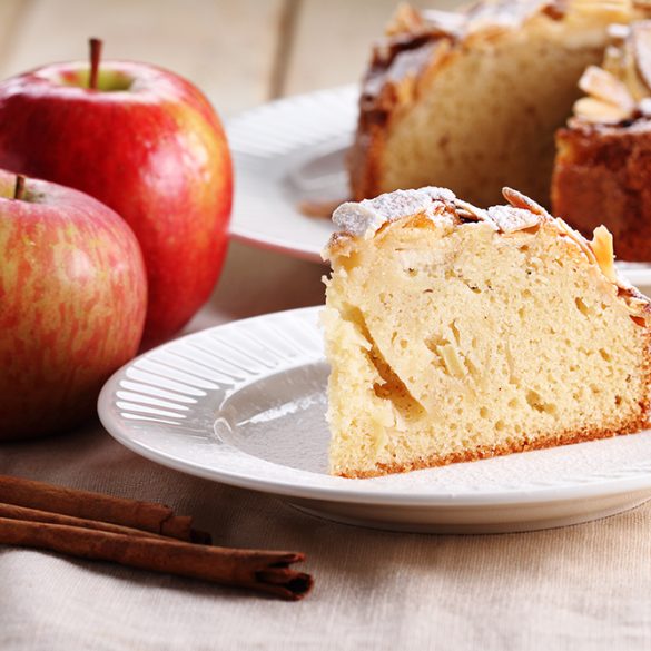 sweet homemade apple cake with almond on white plate