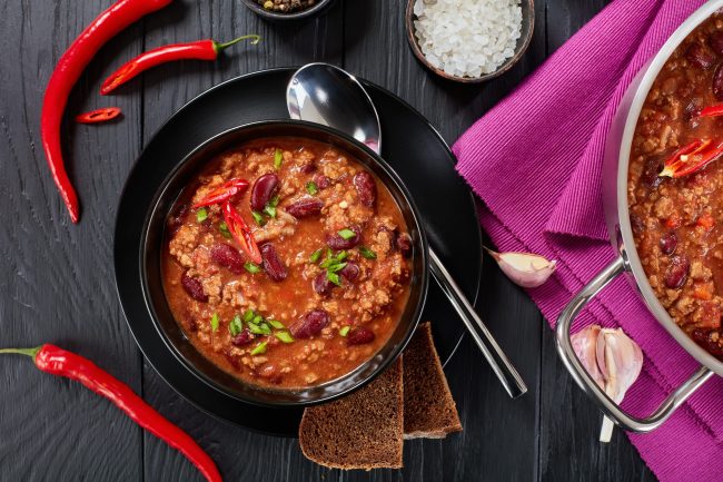 chili con carne in black bowl