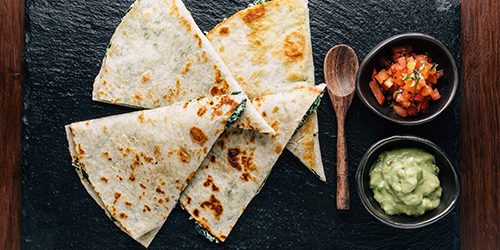 ฺTop view of Baked Spinach and Cheese Quesadillas served with